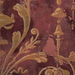 Burgundy aged lime plaster scrollwork